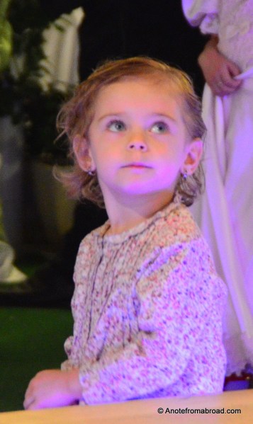 This adorable child looked on with wonder in her eyes at the performers danced