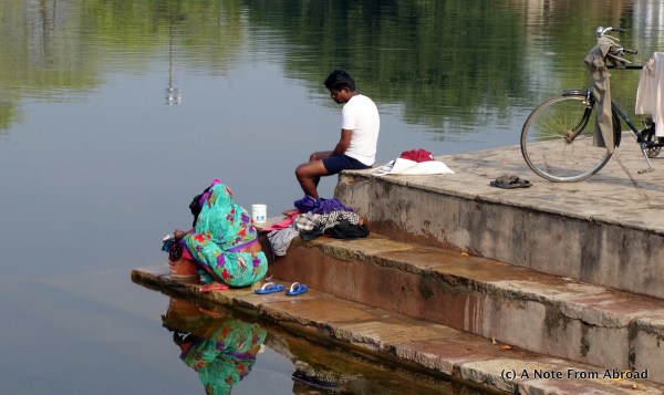 Washing clothes in the pond