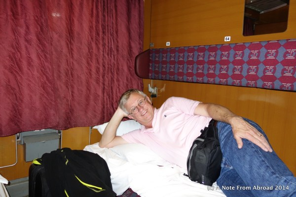 Tim relaxing in our sleeper train compartment
