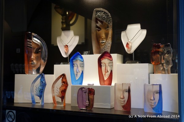 Glass faces in a shop window