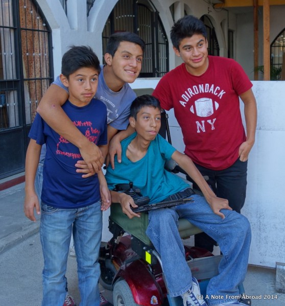 The young man in the center has MS and was provided with a wheel chair.