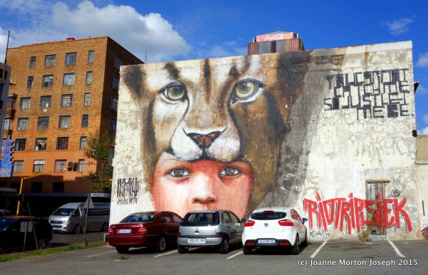 Graphitti drawings on side of the building