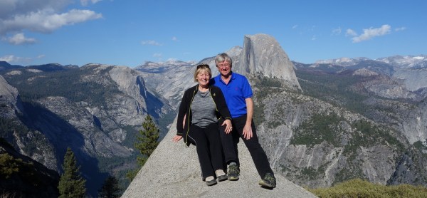 Sitting on a rock at Glacier Point, overlooking the Curry Vilage 3,214 feet below