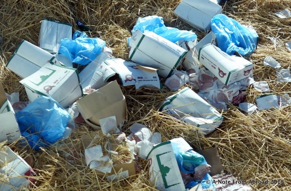 Cases of rotting meat has been dumped in the road