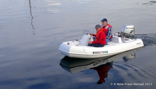 Jan and Mark are in our little dingy, coming back to the boat, after a hike on Cypress Island