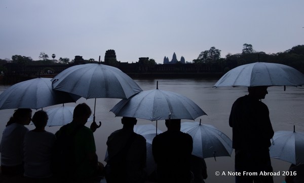 The sky opens and the umbrellas go up