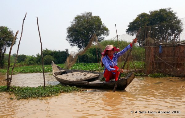 Dressed to the nines while paddling her canoe