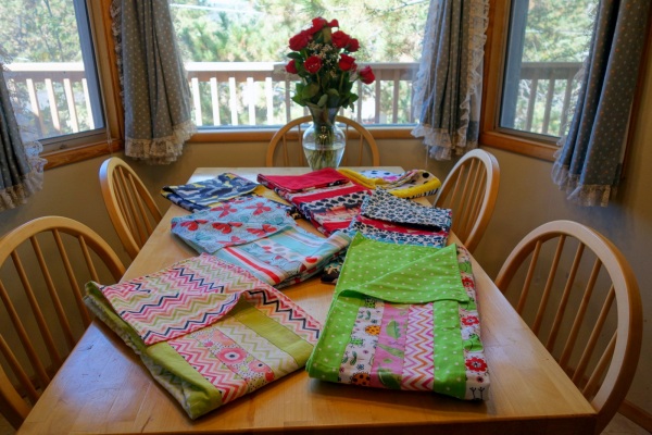 Seven of the finished blankets ready to donate